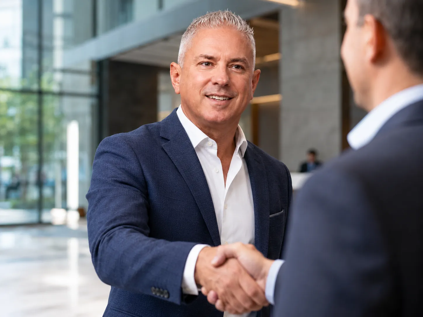 David Gembala shaking hands at a business meeting